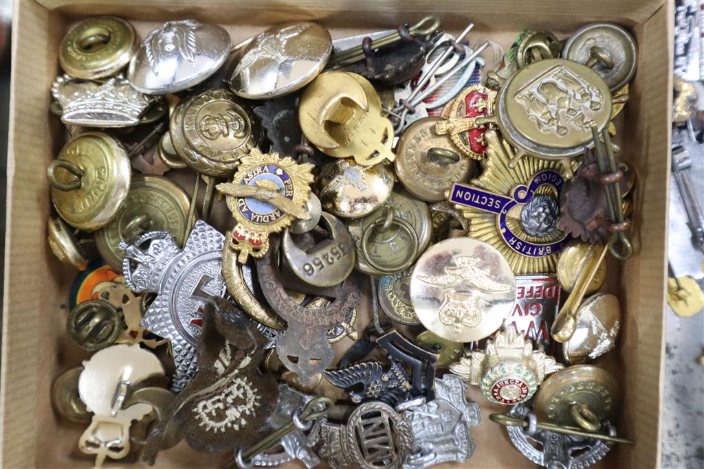 A quantity of badges, including military